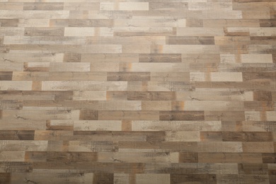 Wooden laminate as background, top view. Floor covering