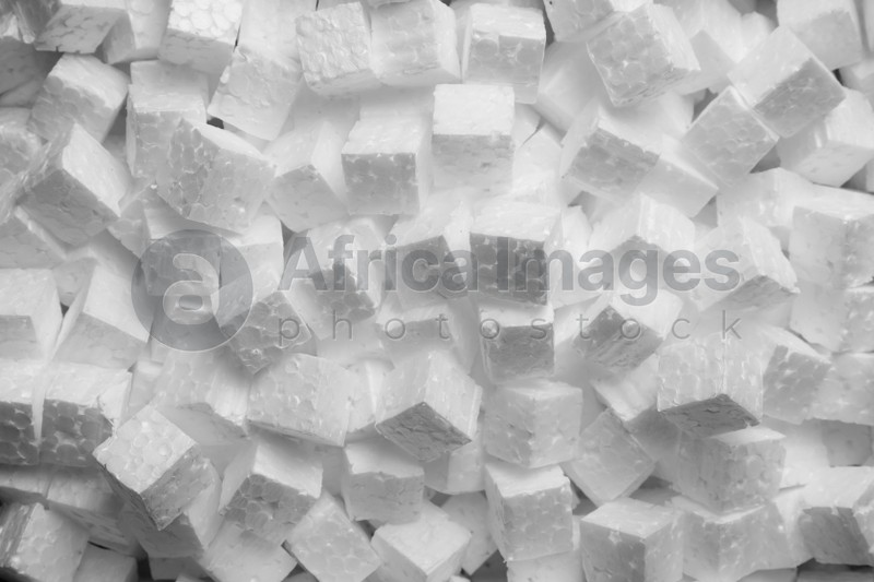 Polystyrene styrofoam pieces for packaging as background, top view