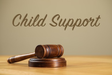 Judge's gavel on wooden table. Child support concept