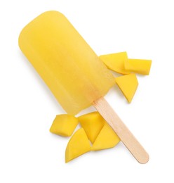 Tasty mango ice pop isolated on white, top view. Fruit popsicle
