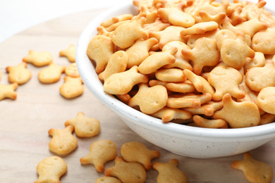 Delicious goldfish crackers in bowl, closeup view