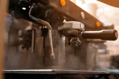 Professional coffee machine with steam wand, closeup