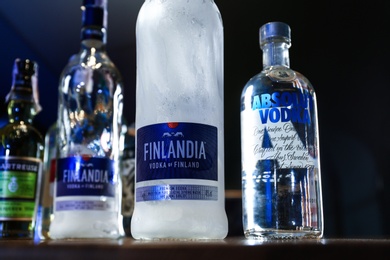 MYKOLAIV, UKRAINE - SEPTEMBER 24, 2019: Bottles of global vodka brands on counter in bar