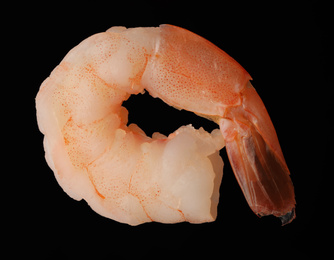 Photo of Freshly cooked delicious shrimp on black background