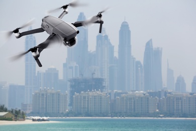 Modern drone on blurred cityscape. Aerial survey