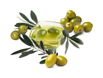 Bowl of oil, ripe olives and leaves on white background 