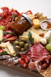 Photo of Assorted appetizer served on white wooden table
