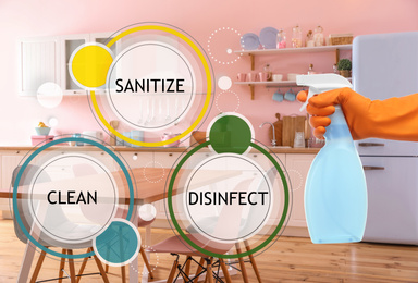 Keep your home virus-free. Woman cleaning kitchen with disinfecting solution