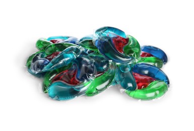 Heap of laundry capsules on white background
