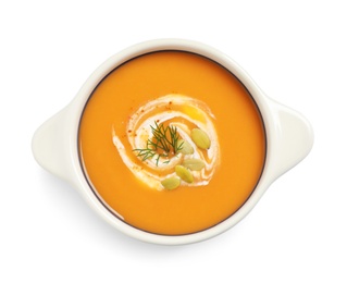 Tasty creamy pumpkin soup with dill and seeds in bowl on white background, top view