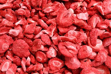 Photo of Closeup of freeze dried strawberries as background, top view