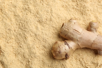Photo of Raw root dry powdered ginger, top view. Space for text