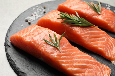 Photo of Fresh raw salmon and ingredients for marinade on grey, closeup