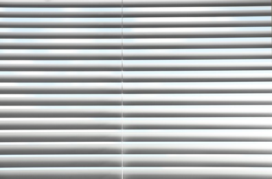 Closeup view of window with horizontal blinds