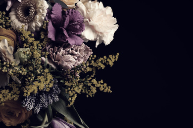 Beautiful bouquet of different flowers on black background, space for text. Floral card design with dark vintage effect