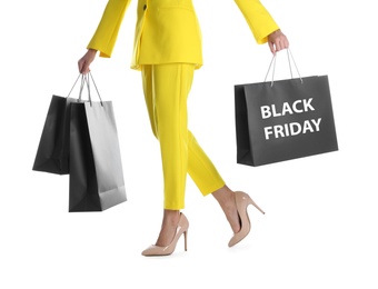 Woman with shopping bags on white background, closeup. Black Friday Sale