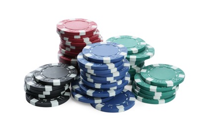 Plastic casino chips stacked on white background. Poker game