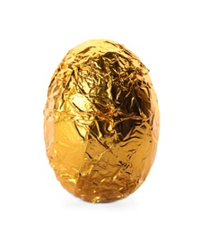 Chocolate egg wrapped in bright golden foil isolated on white