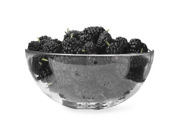 Delicious ripe black mulberries in glass bowl on white background