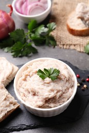 Photo of Delicious lard spread in bowl on grey table