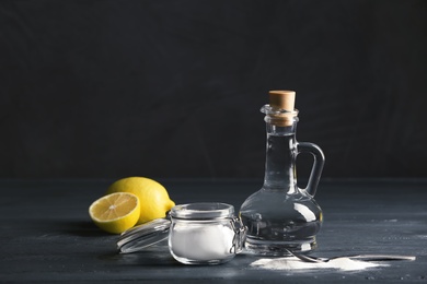 Composition with vinegar, lemons and baking soda on table