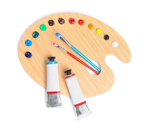 Palette with acrylic paints and brushes on white background, top view. Artist equipment