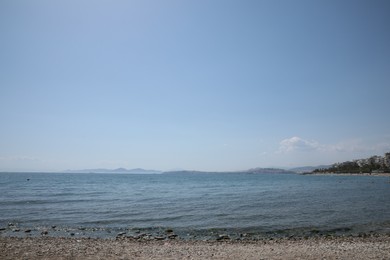 Photo of Picturesque view of beach and calm sea on sunny day