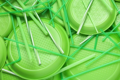 Different green plastic items as background, closeup