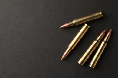 Bullets on black background, flat lay. Space for text