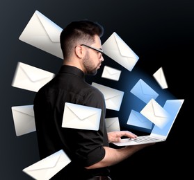 Email spam. Young man with laptop and many letters on black background