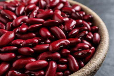 Raw red kidney beans in wooden bowl, closeup