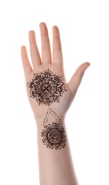 Little girl with henna tattoo on palm against white background, closeup. Traditional mehndi ornament