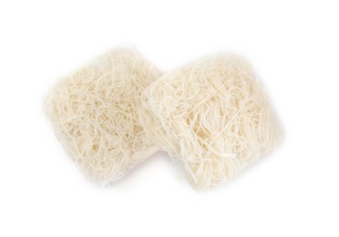 Bricks of dried rice noodles on white background, top view
