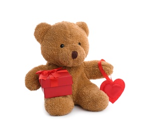 Cute teddy bear with red heart and gift box on white background. Valentine's day celebration