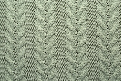Grey knitted wool texture as background, top view