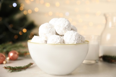 Christmas snowball cookies in bowl on light table