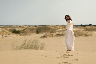 Jesus Christ walking in desert. Space for text