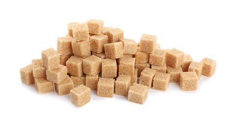 Pile of cubes with brown sugar on white background