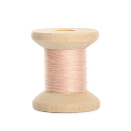 Wooden spool of pale pink sewing thread isolated on white