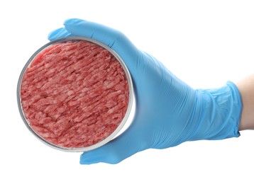 Photo of Scientist holding Petri dish with raw minced cultured meat on white background, top view