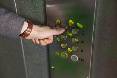 Man press button in elevator with germs, closeup