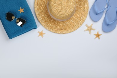 Photo of Flat lay composition with beach objects on white background, space for text