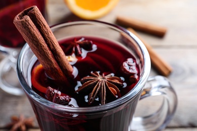 Delicious red mulled wine on table, closeup