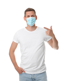 Male volunteer in mask on white background. Protective measures during coronavirus quarantine