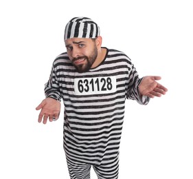 Prisoner in special uniform perplexedly shrugging his shoulders on white background