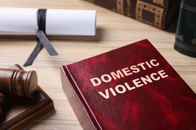 Domestic violence law book on wooden table