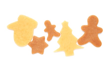 Unbaked Christmas cookies on white background, top view