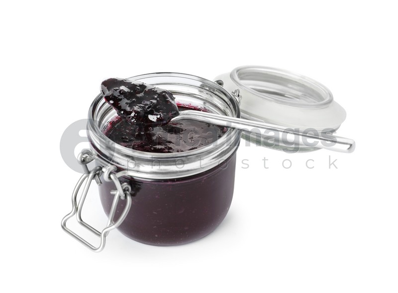 Photo of Spoon and jar of blueberry jam isolated on white