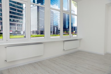 Empty office room with clean windows and radiators. Interior design