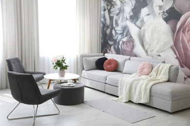 Modern living room interior with comfortable sofa and armchairs